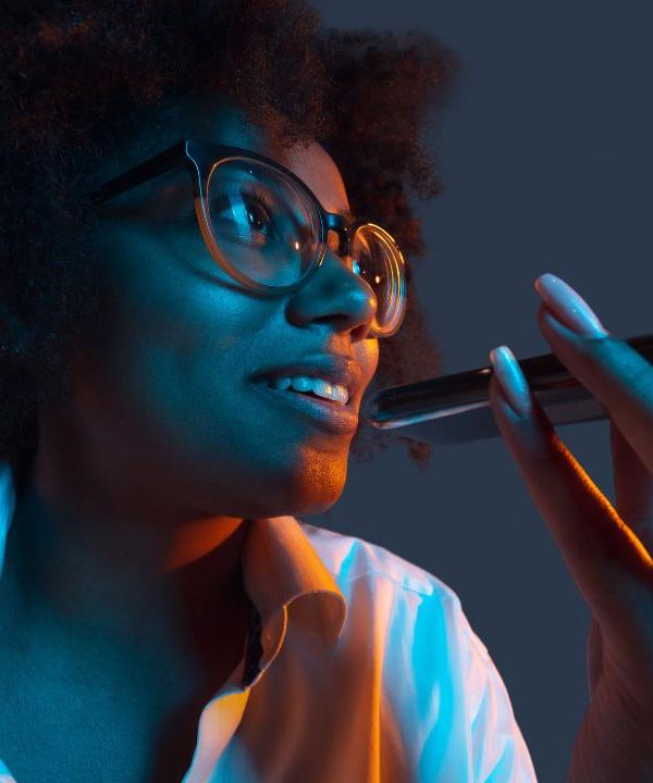 Woman holding a phone and searching Google, illustrating SEO tips that help a coach website rank for client searches