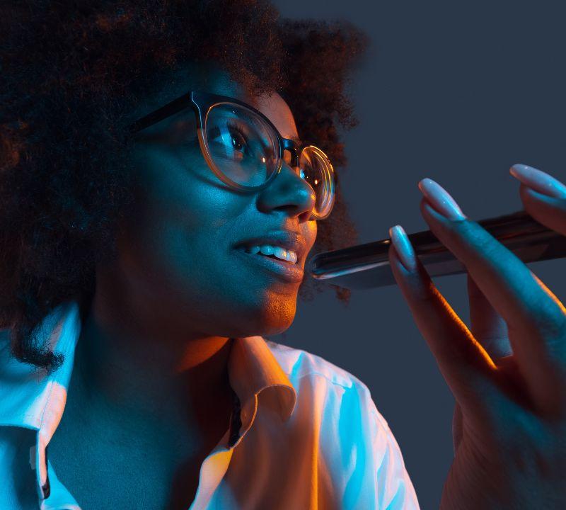 Woman holding a phone and searching Google, illustrating SEO tips that help a coach website rank for client searches Woman holding a phone and searching Google, illustrating SEO tips that help a coach website rank for client searches